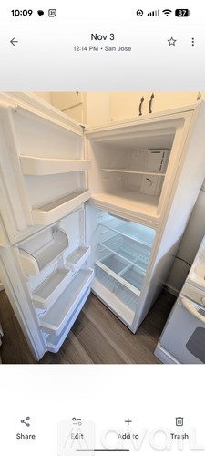 A photo of an empty refrigerator with the door open.
