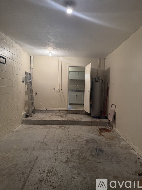 A bathroom under construction with a shower and a toilet.