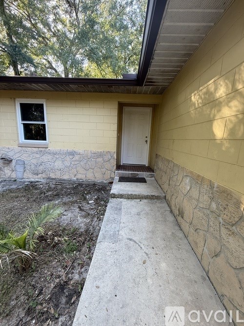 A small house with a white door and a window.