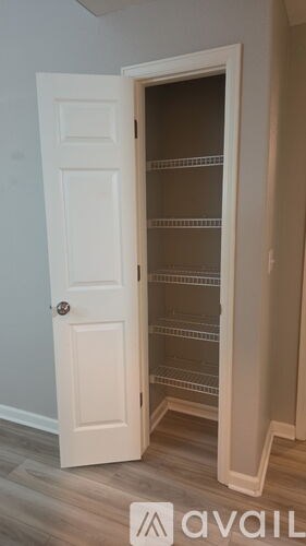 A white door with a glass panel is open.