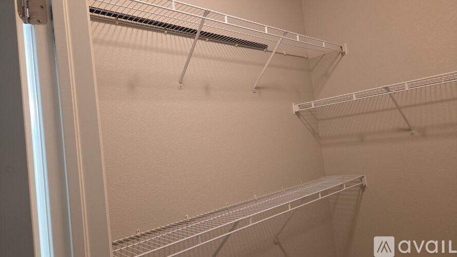 Empty white shelves in a room.