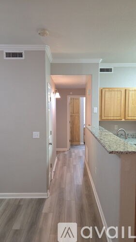 A kitchen with a counter top and cabinets.