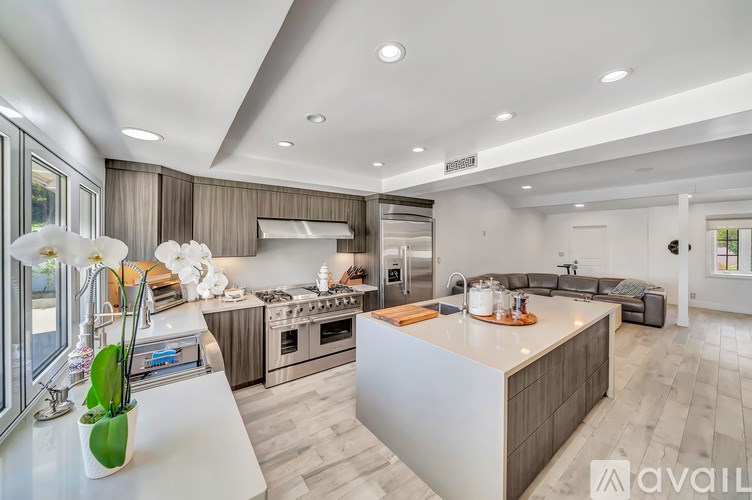 A modern kitchen with a large island in the center.