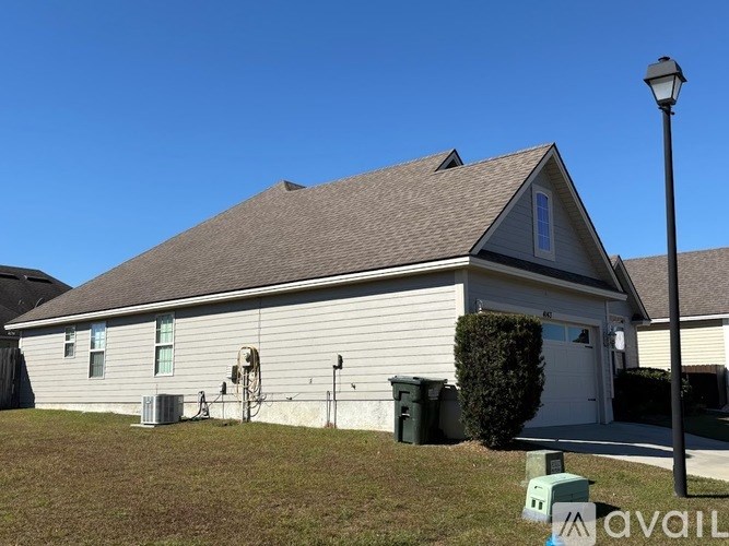 A house with a garage and a driveway.