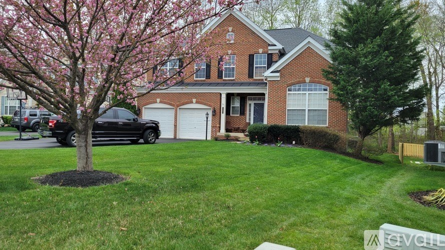 A dining room with a table set for four.