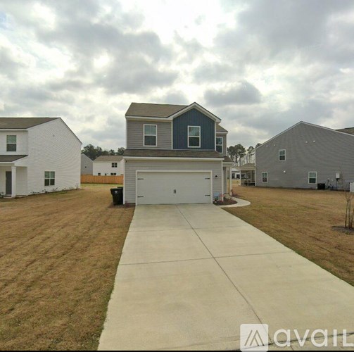 A house with a garage is for sale.