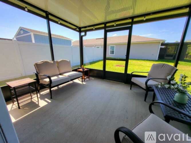 A patio with a table and chairs is available for rent.