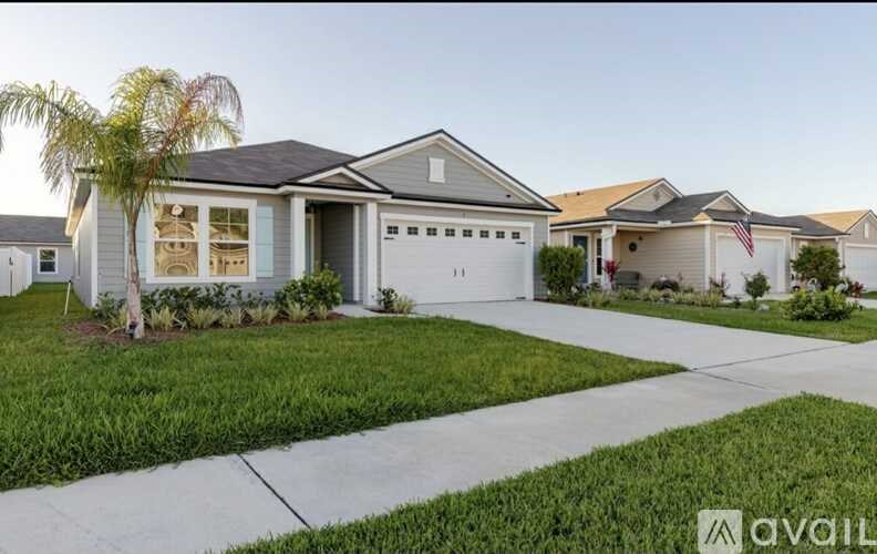A house with a palm tree in front of it.