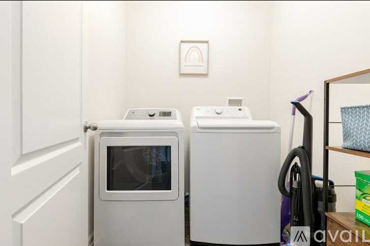 A white microwave and dishwasher are in a kitchen.
