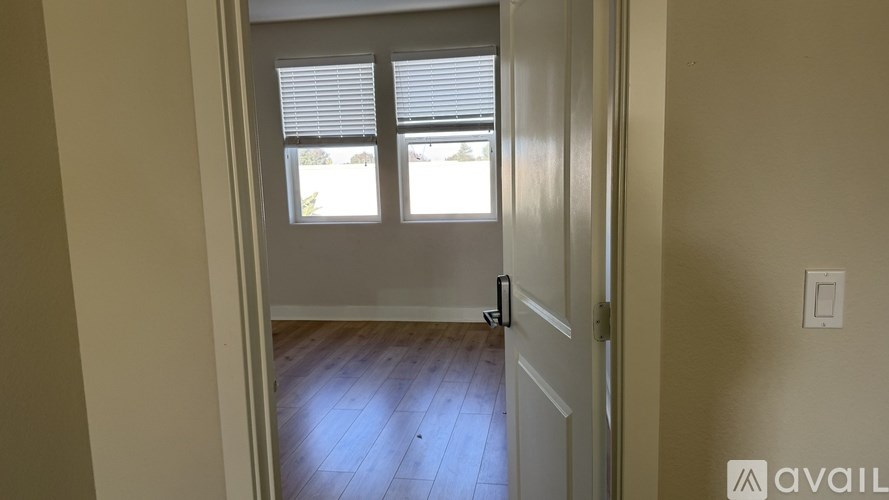 A room with a door and a window.