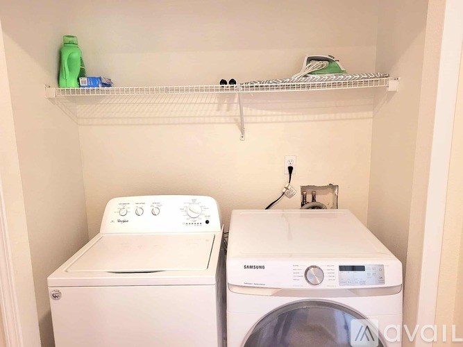 A white dryer is next to a white washing machine.