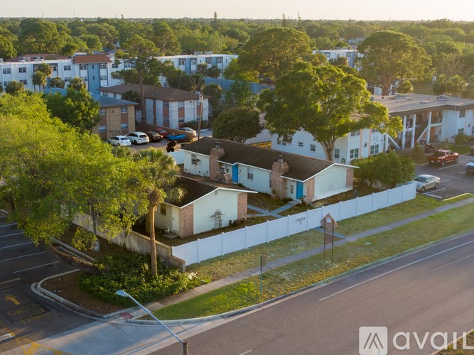 A residential area with houses and trees.