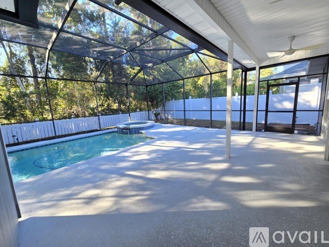 A pool inside a house with a glass ceiling.