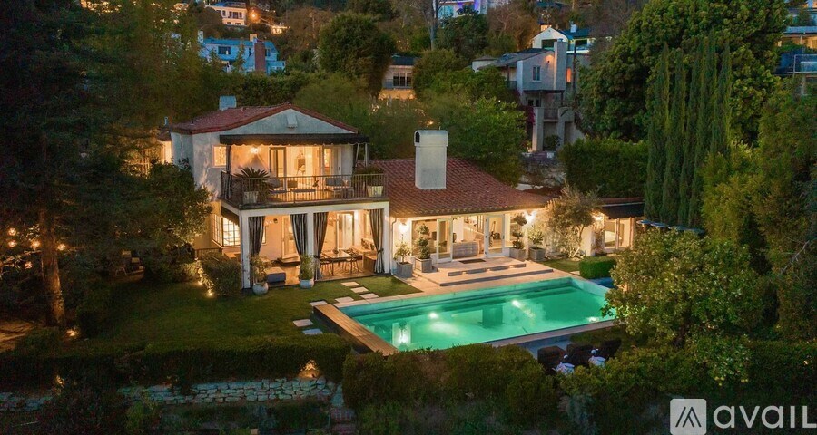 A house with a pool in the backyard is on the market.