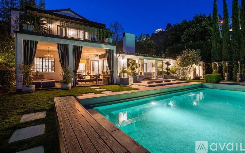 A modern house with a pool in the backyard.