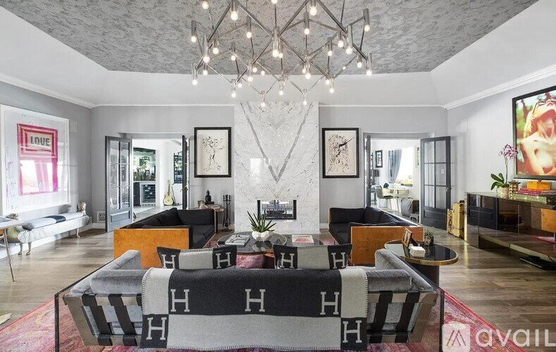 A modern living room with a black and white sofa.