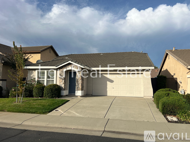 A house with a garage is for sale.
