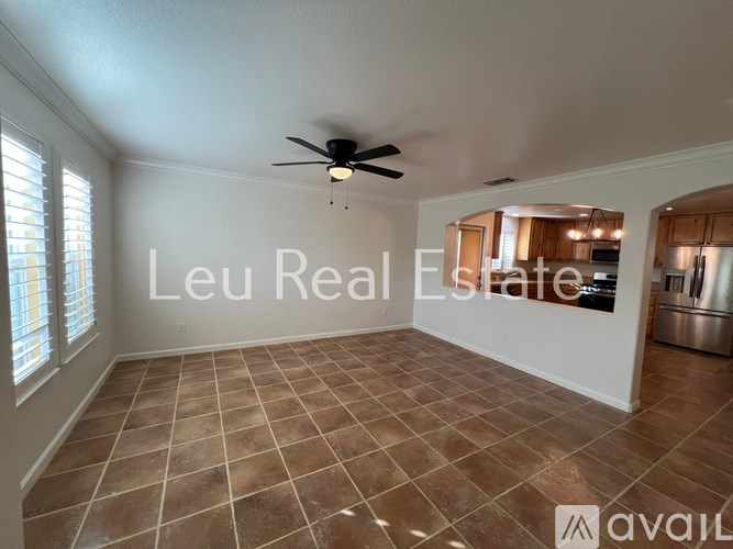 A room with a ceiling fan and tile flooring is available for lease.