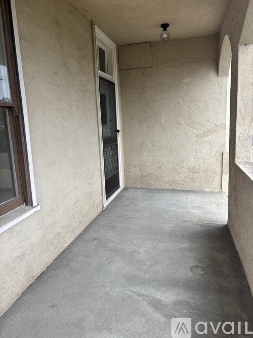 A room with a concrete floor and a window.