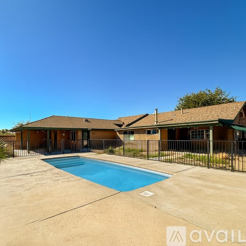 A house with a pool in the backyard.