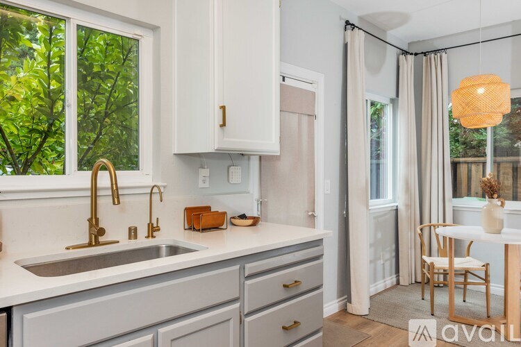 A kitchen with a sink and a window.