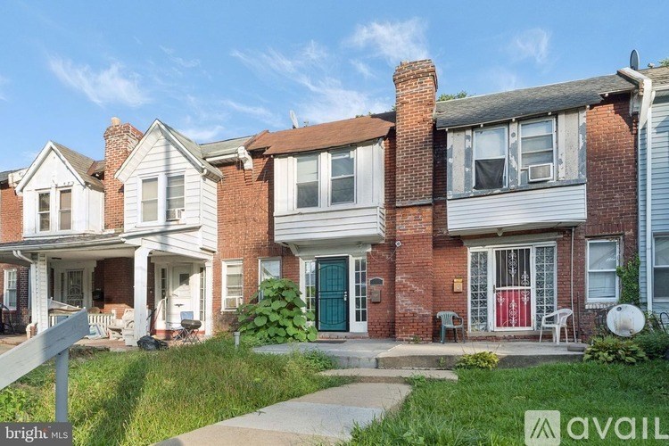 A row of houses with a sign that says "available" in front of the first one.