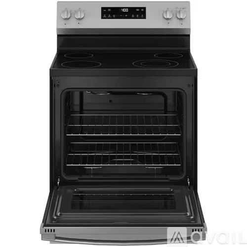 A black and silver oven with the door open.