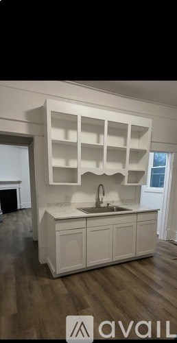 A kitchen with a sink and cabinets.