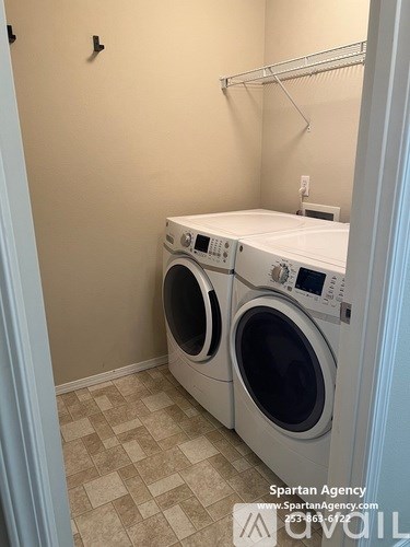 A laundry room with a washer and dryer.