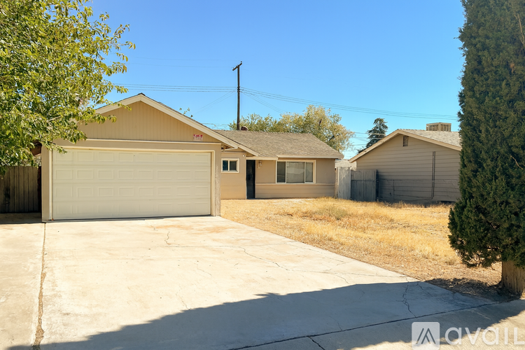 A house with a garage is available for rent.