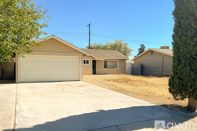 A house with a garage is available for rent.