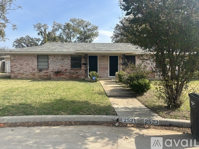 A house with a brick exterior is for sale.