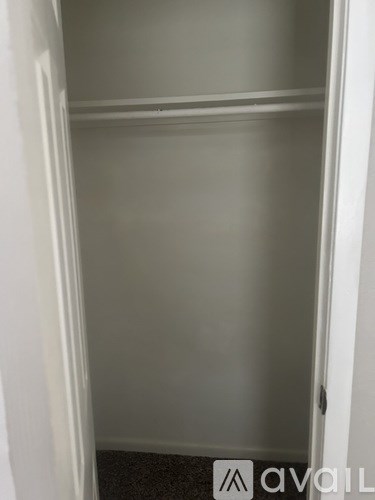 A white door with a handle on the right side.