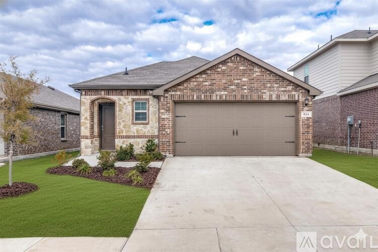 A house with a garage and a driveway.