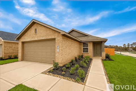 A house with a garage and a driveway.