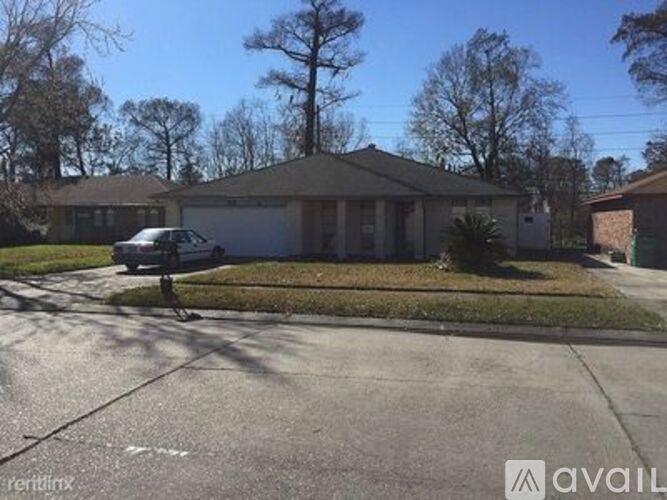 A house with a car parked in front of it.