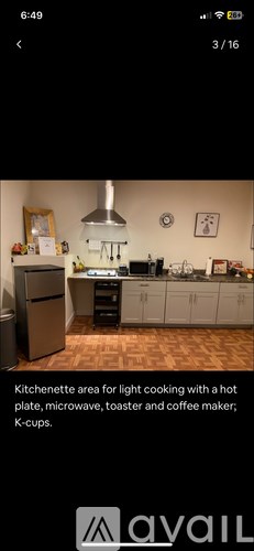 A kitchenette area with a hot plate, microwave, toaster, and coffee maker.
