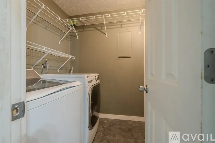 A laundry room with a washer and dryer.