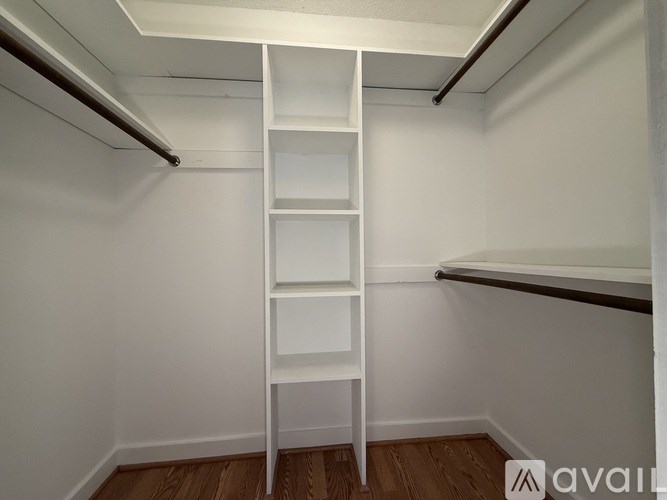 A white ladder in a room with wooden flooring.
