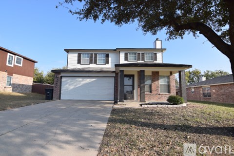 A house with a white garage door is for sale.