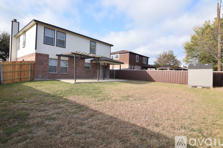 A house with a fence and a yard.