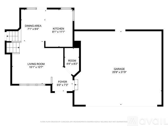 A floor plan for a home with a living room, dining area, kitchen, garage, and foyer.