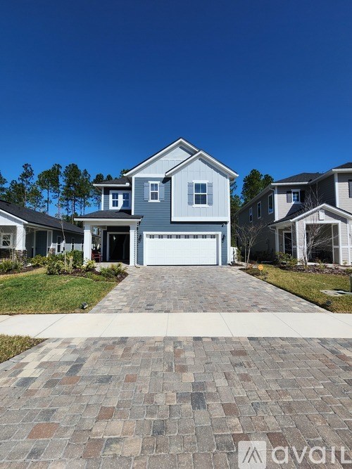 A house with a driveway in front of it.