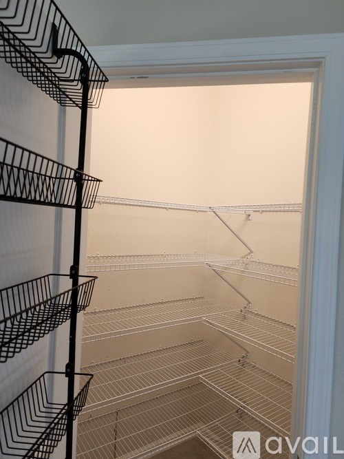 Empty shelves in a room with white walls.