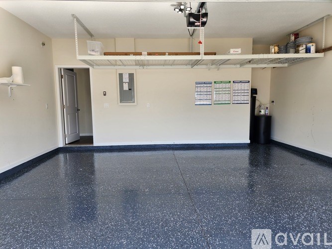 A room with a blue floor and white walls.