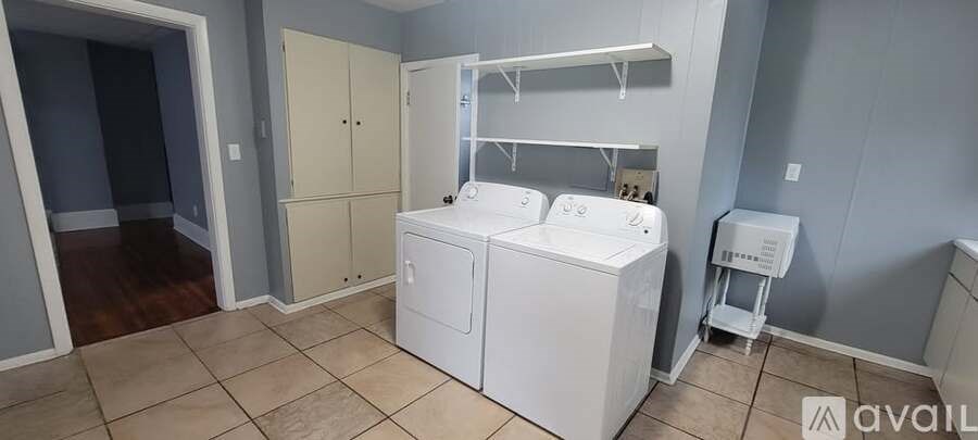 A laundry room with a washer and dryer.