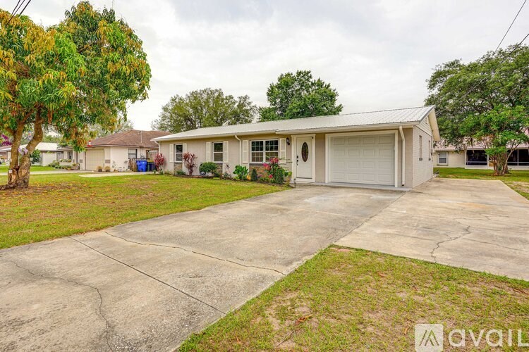 A house with a garage is for sale.