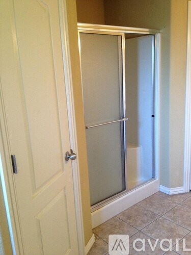 A white door with a glass panel and a handle.
