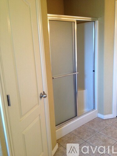 A white door with a glass panel and a handle.