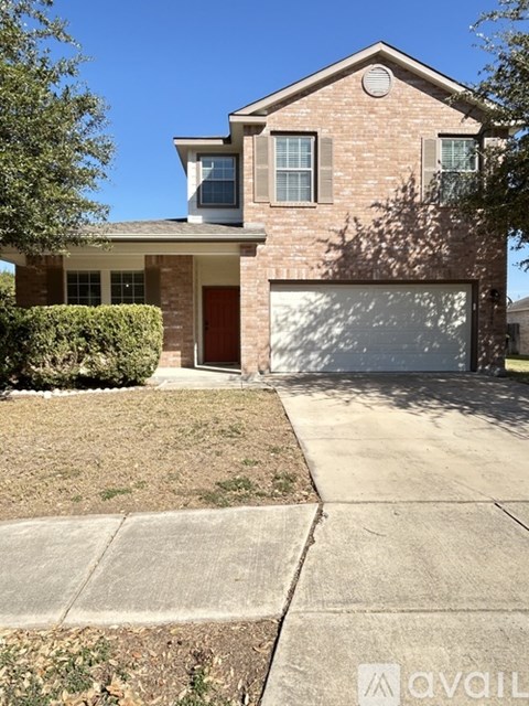 A house with a brick facade and a white garage door.